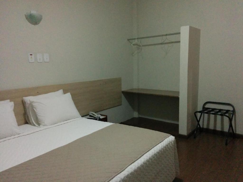 Postel nebo postele na pokoji v ubytování Itabuna Palace Hotel