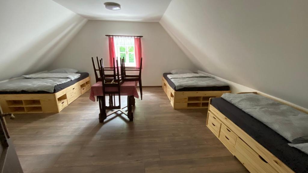Postel nebo postele na pokoji v ubytování Chalupa Horní Heřmanice