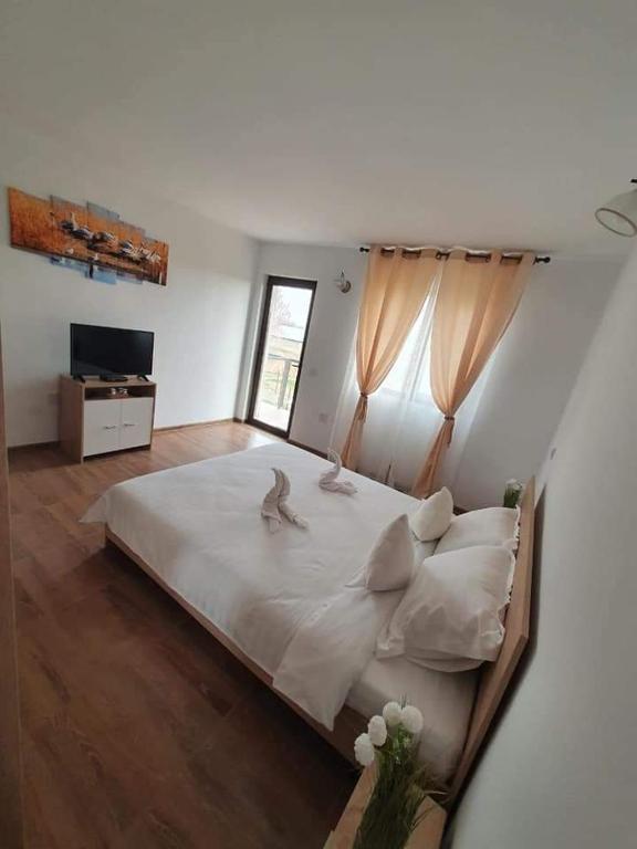 Postel nebo postele na pokoji v ubytování CASA RIZEA