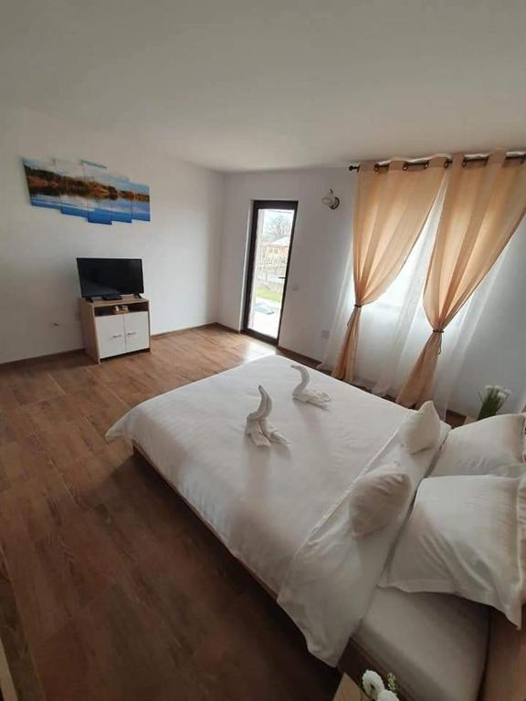 Postel nebo postele na pokoji v ubytování CASA RIZEA