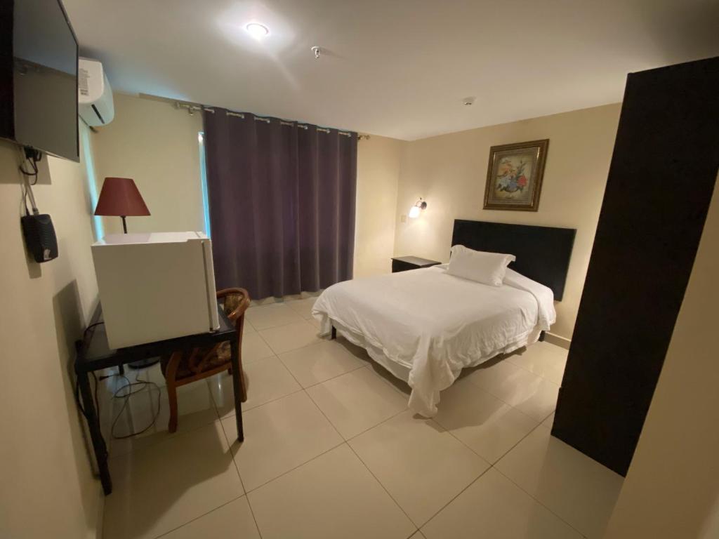 Voodi või voodid majutusasutuse Hotel F Sur Inn toas