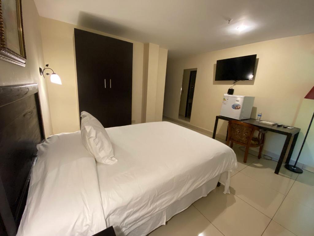 Voodi või voodid majutusasutuse Hotel F Sur Inn toas