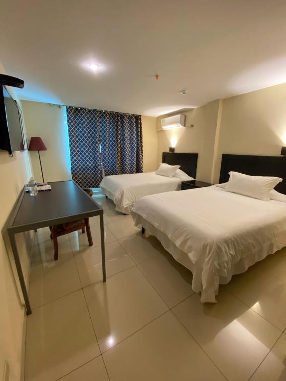 Voodi või voodid majutusasutuse Hotel F Sur Inn toas