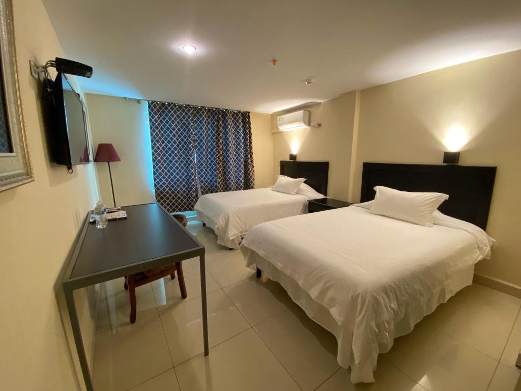 Voodi või voodid majutusasutuse Hotel F Sur Inn toas