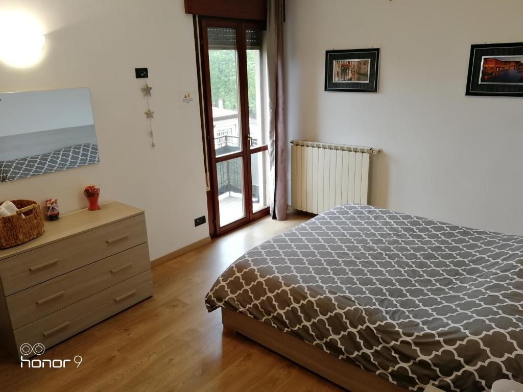 Posteľ alebo postele v izbe v ubytovaní Appartamento Ca' Lela