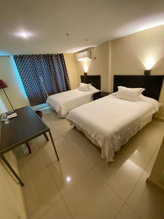 Voodi või voodid majutusasutuse Hotel F Sur Inn toas