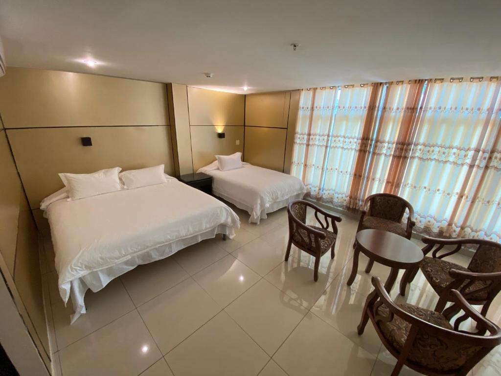 Voodi või voodid majutusasutuse Hotel F Sur Inn toas