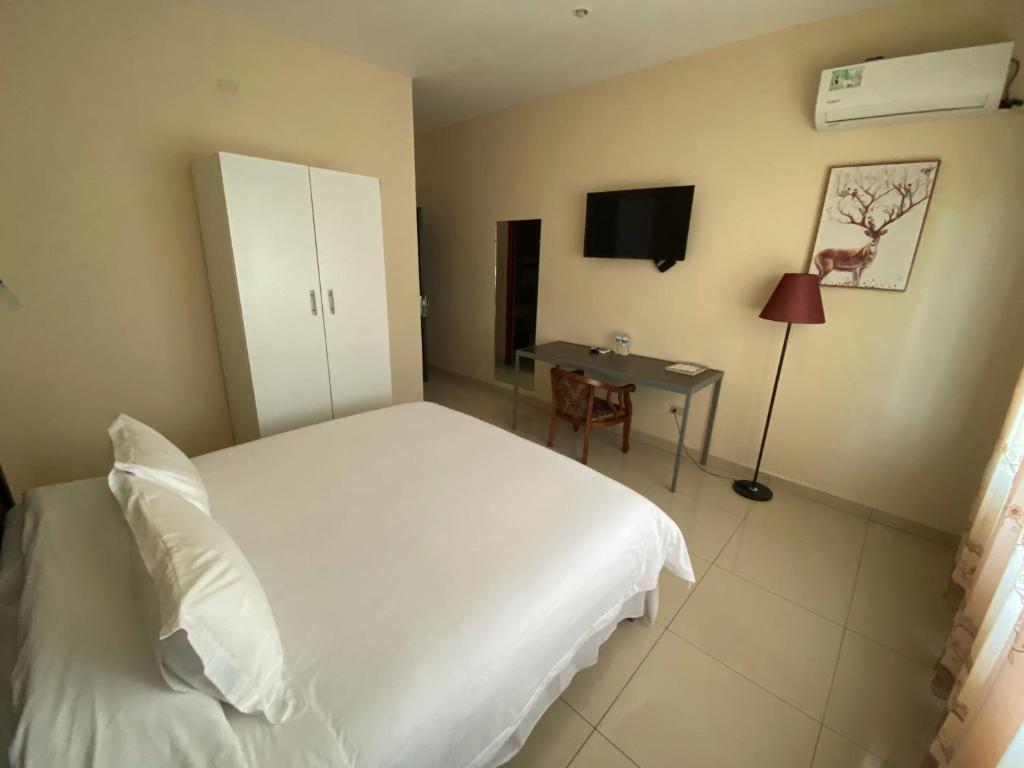 Voodi või voodid majutusasutuse Hotel F Sur Inn toas