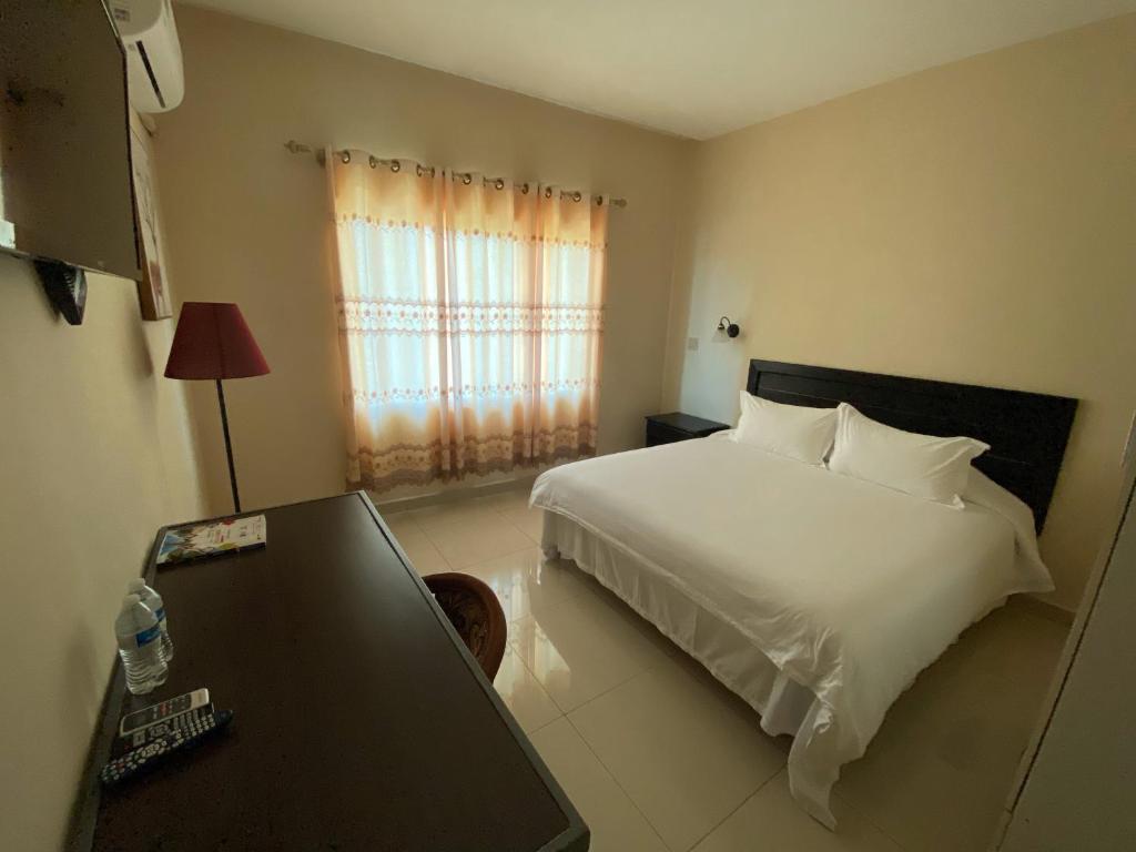 Voodi või voodid majutusasutuse Hotel F Sur Inn toas