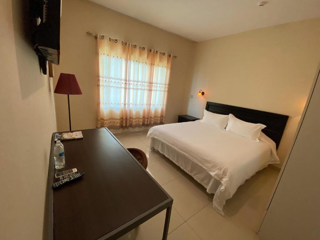 Voodi või voodid majutusasutuse Hotel F Sur Inn toas