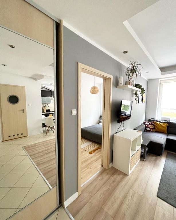 Televízia a/alebo spoločenská miestnosť v ubytovaní Warszawska 1 Apartament Giżycko