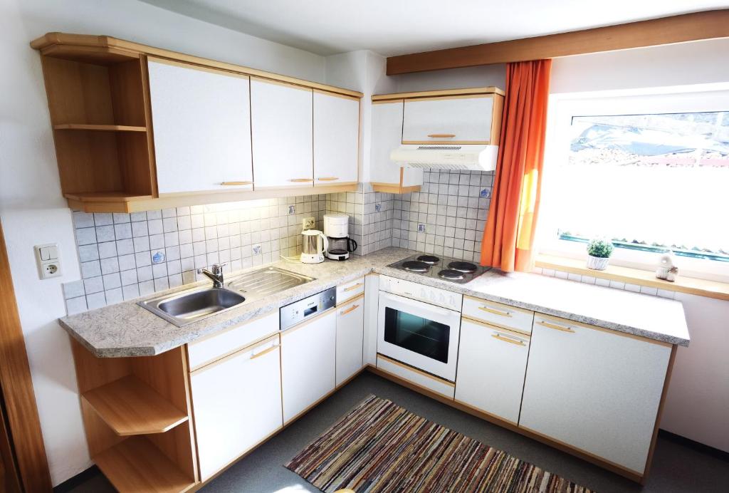 Kuchyň nebo kuchyňský kout v ubytování Gästehaus Scherl