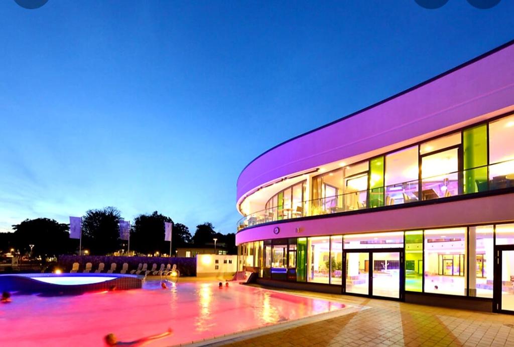a large building with a lot of windows at night at Studio mit schöner Aussicht in Bad Rothenfelde