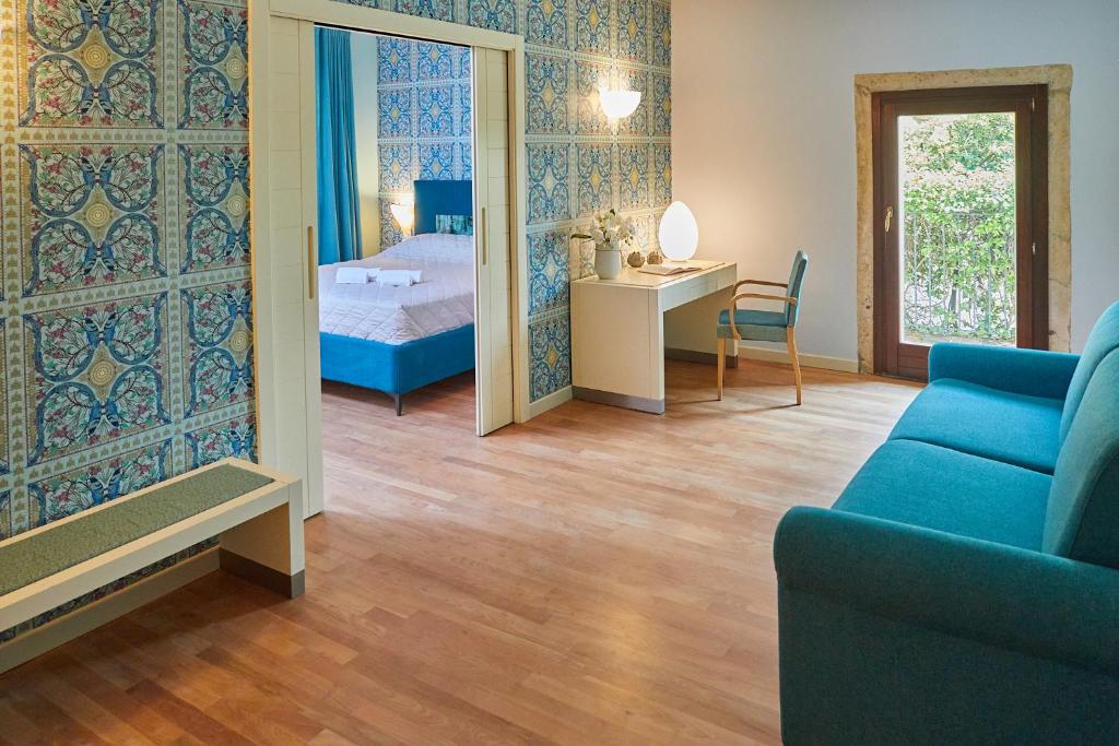 Postel nebo postele na pokoji v ubytování Ca' Masieri Hotel