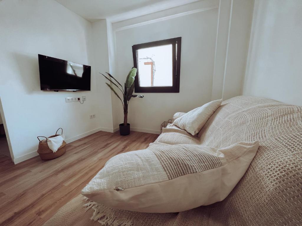 Postel nebo postele na pokoji v ubytování Apartamento en el nucli antic de l'Escala