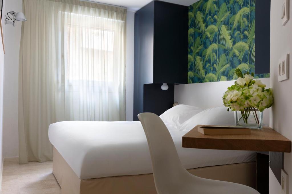 Postel nebo postele na pokoji v ubytování Hotel Alcyon