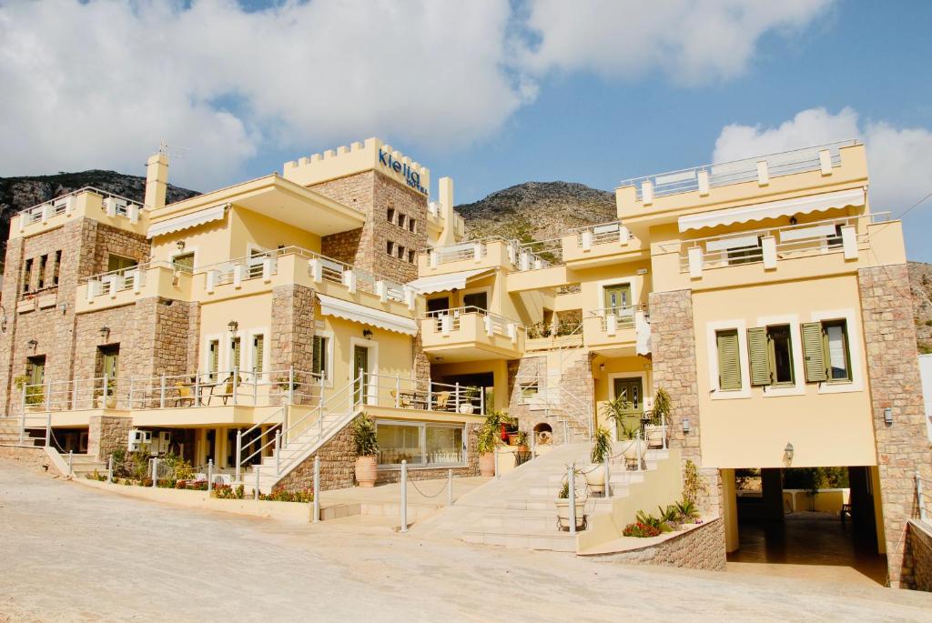 a large building with stairs in front of it at Klelia Hotel in Monemvasia