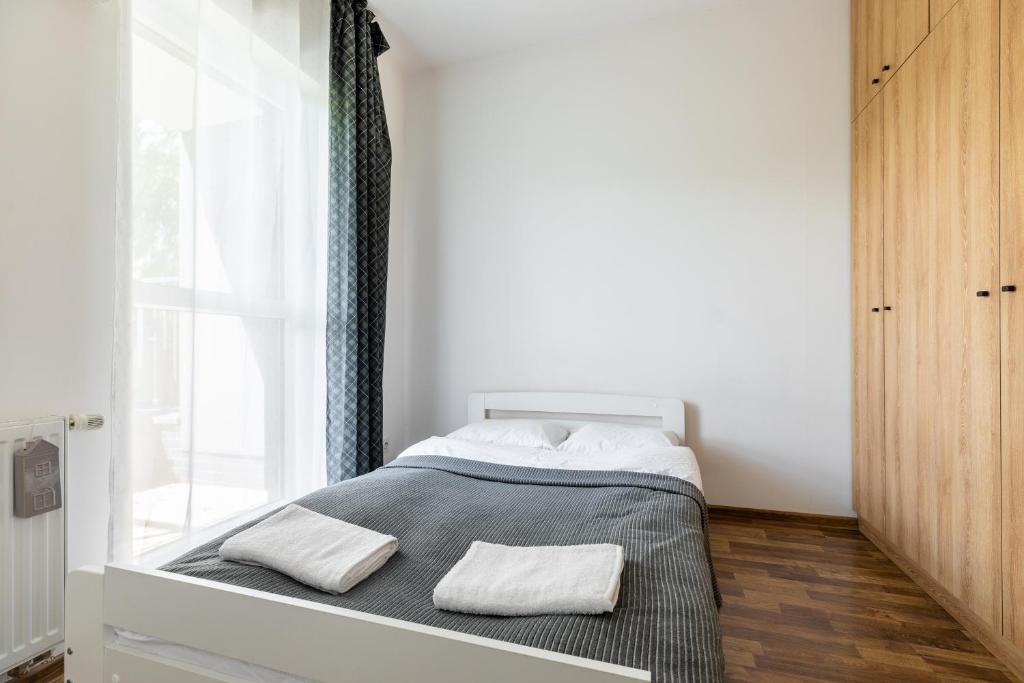 Posteľ alebo postele v izbe v ubytovaní Wagonowa P&O Apartments