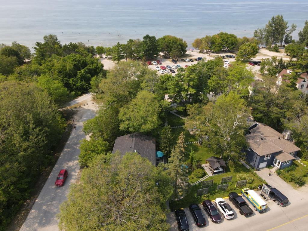 an aerial view of a house with cars parked in a parking lot at Adrians Wasaga Beach in Wasaga Beach