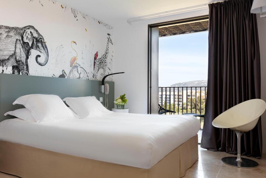 Postel nebo postele na pokoji v ubytování Hotel Alcyon