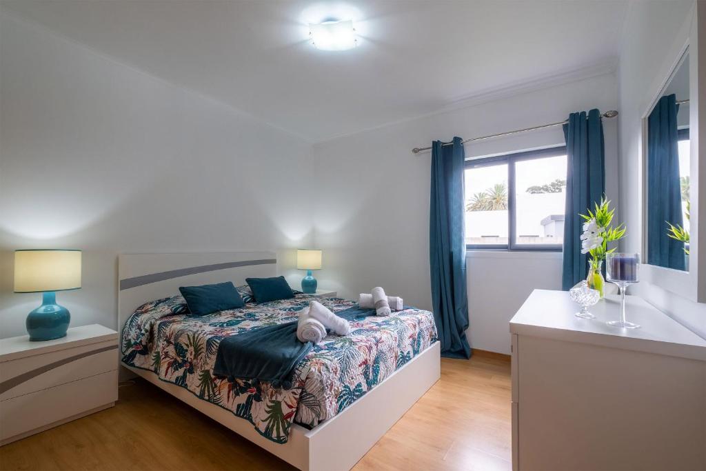 En eller flere senge i et værelse på Happy Home