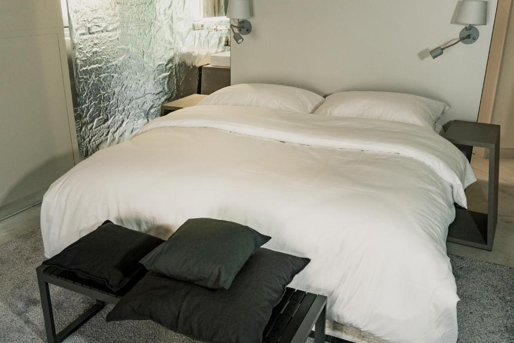 Postel nebo postele na pokoji v ubytování Hotel 49
