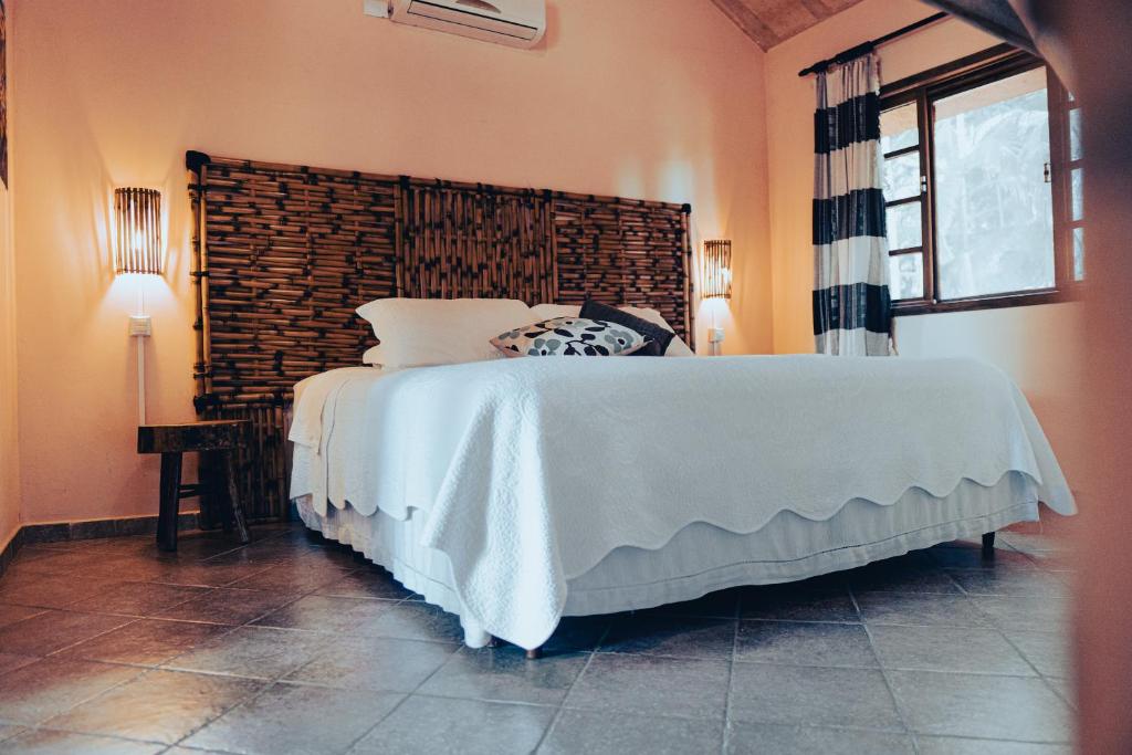 Postel nebo postele na pokoji v ubytování Casas Di Monte Ecopousada
