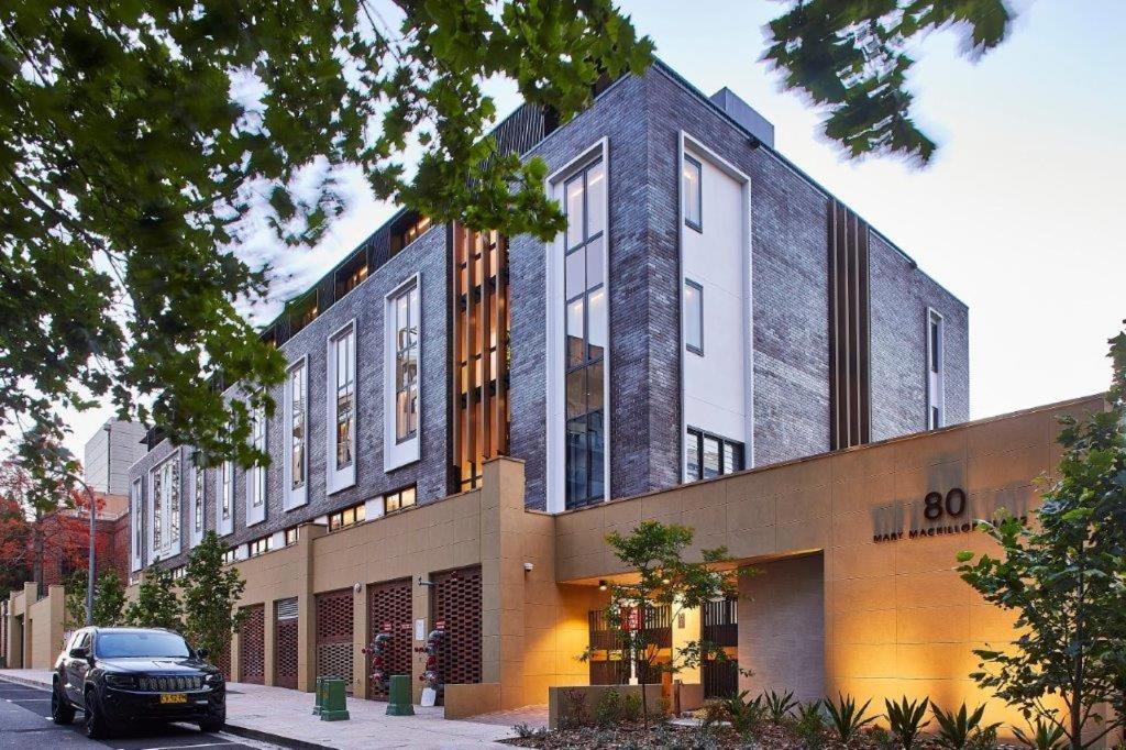 a building with a car parked in front of it at Mary MacKillop Place in Sydney