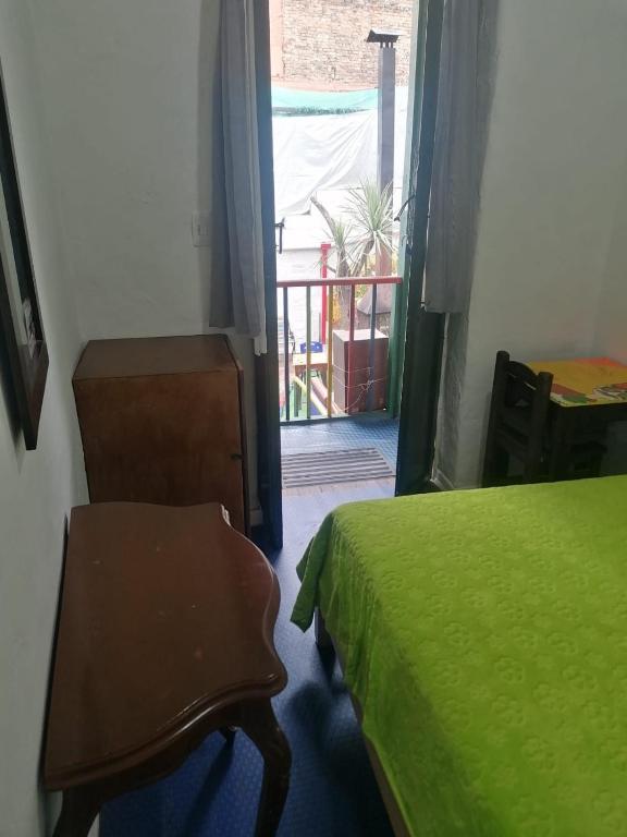 Postel nebo postele na pokoji v ubytování Hostal Gastro Bar Casa Colibrí
