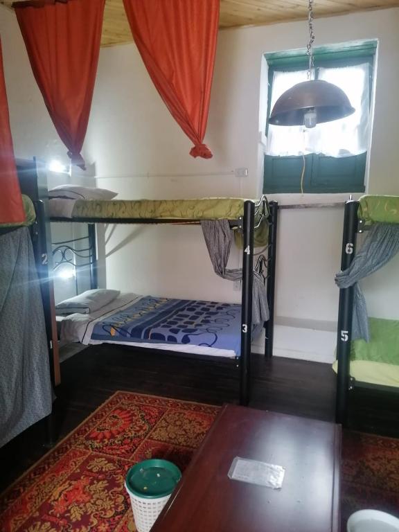 Postel nebo postele na pokoji v ubytování Hostal Gastro Bar Casa Colibrí