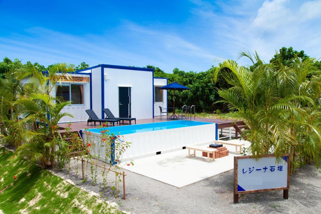 a house on the beach with a swimming pool at Regina Ishigaki in Ishigaki Island