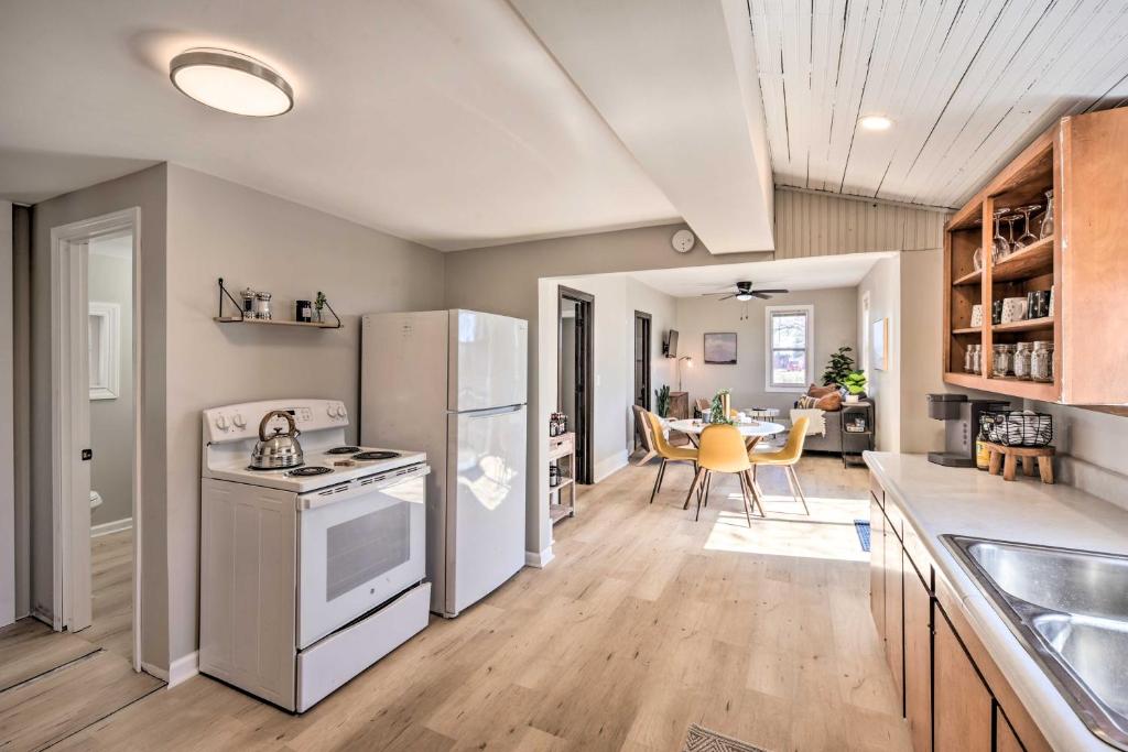 a kitchen with a refrigerator and a dining room at Sunny Superior Home - Swim, Hike, and Explore! in Superior