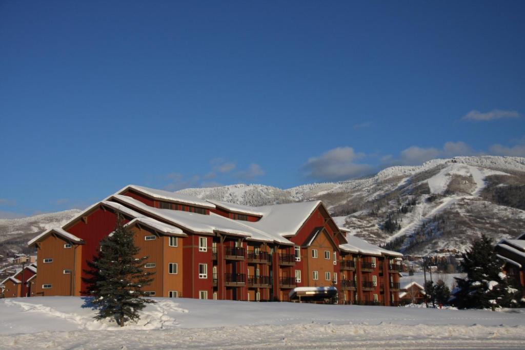 a large building with snow on top of it at The Village at Steamboat in Steamboat Springs