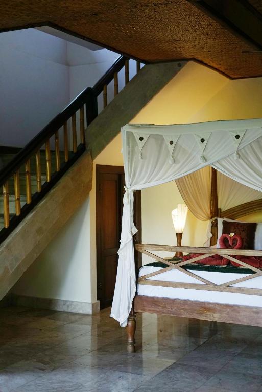 Postel nebo postele na pokoji v ubytování Sunrise Villa Ubud