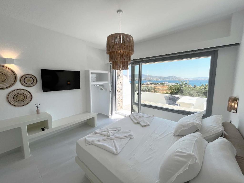 TV a/nebo společenská místnost v ubytování 3Waves Sea View Paros