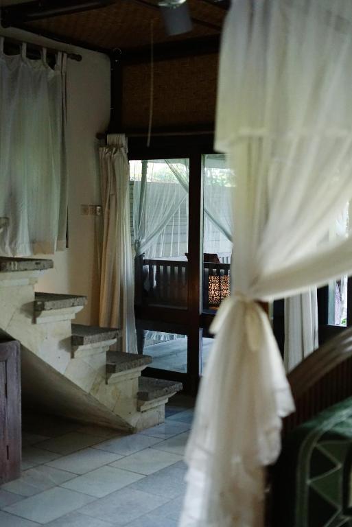 Postel nebo postele na pokoji v ubytování Sunrise Villa Ubud