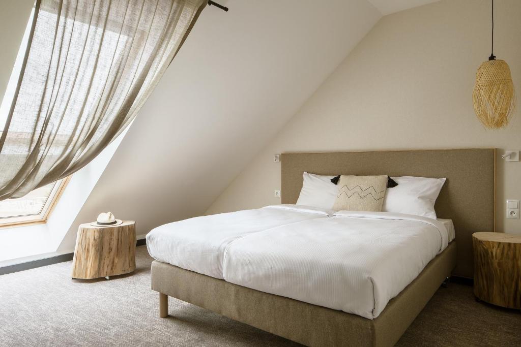 Ein Bett oder Betten in einem Zimmer der Unterkunft Hotel Saltic Resort & Spa Łeba