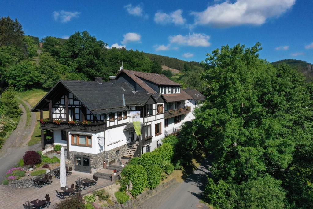 an aerial view of a house in the mountains at Landidyll Landhaus Liesetal in Hallenberg