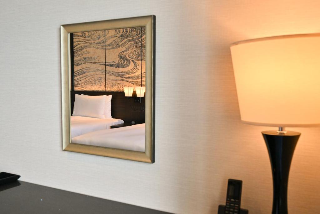 Кровать или кровати в номере Ryukyu Hotel & Resort Nashiro Beach