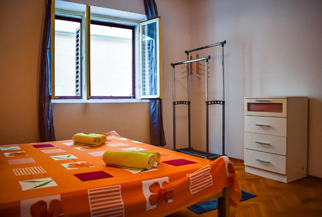 Postel nebo postele na pokoji v ubytování Maslinčica