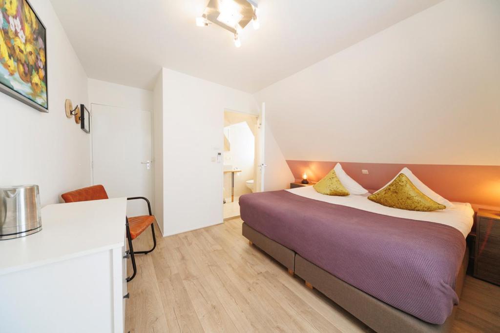 Postel nebo postele na pokoji v ubytování Hotel-Restaurant de Boer'nkinkel