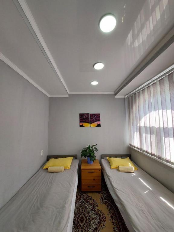 Postel nebo postele na pokoji v ubytování Downtown Homestay