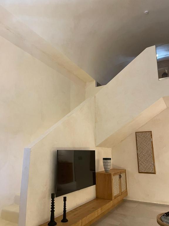 TV a/nebo společenská místnost v ubytování Opalia Suites