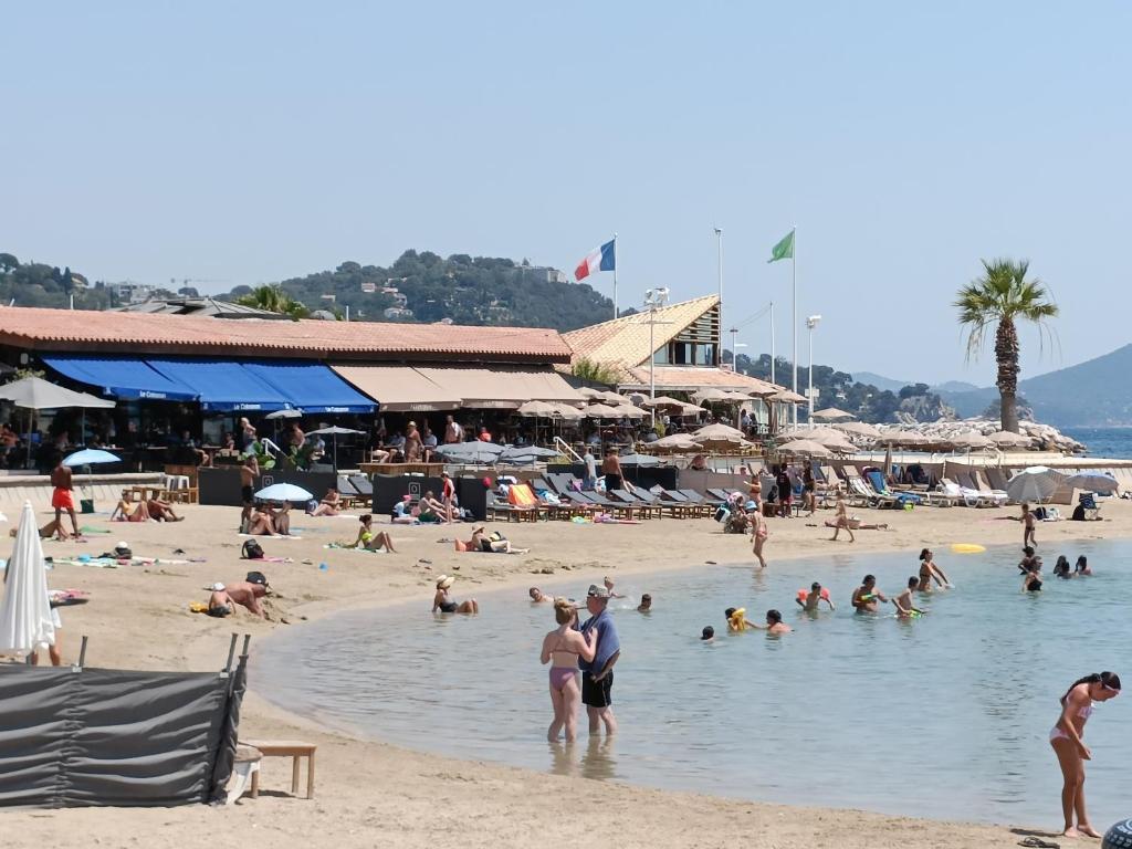a group of people in the water at a beach at Le Côte d'Azur in Toulon