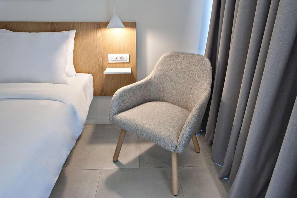Tempat tidur dalam kamar di Radisson Resort Plaza Skiathos
