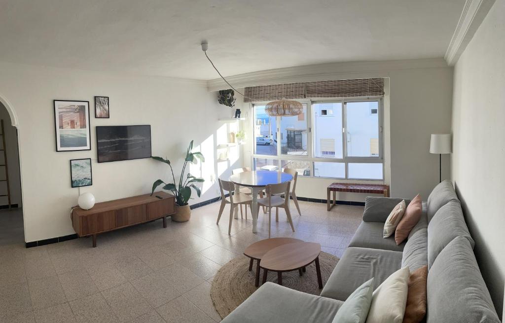 a living room with a couch and a table at Casa Tajo in Tarifa