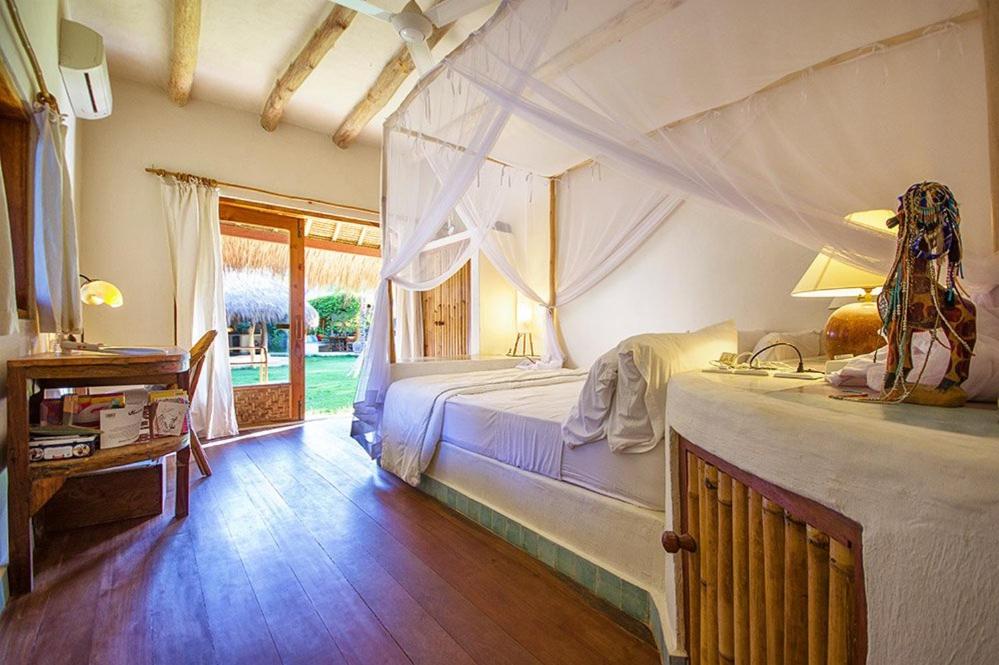Postel nebo postele na pokoji v ubytování Mu Bungalows