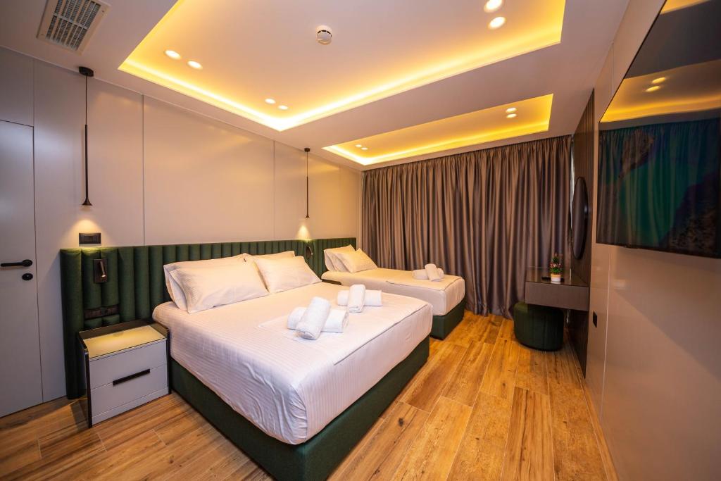 Postel nebo postele na pokoji v ubytování Hotel Lili-1