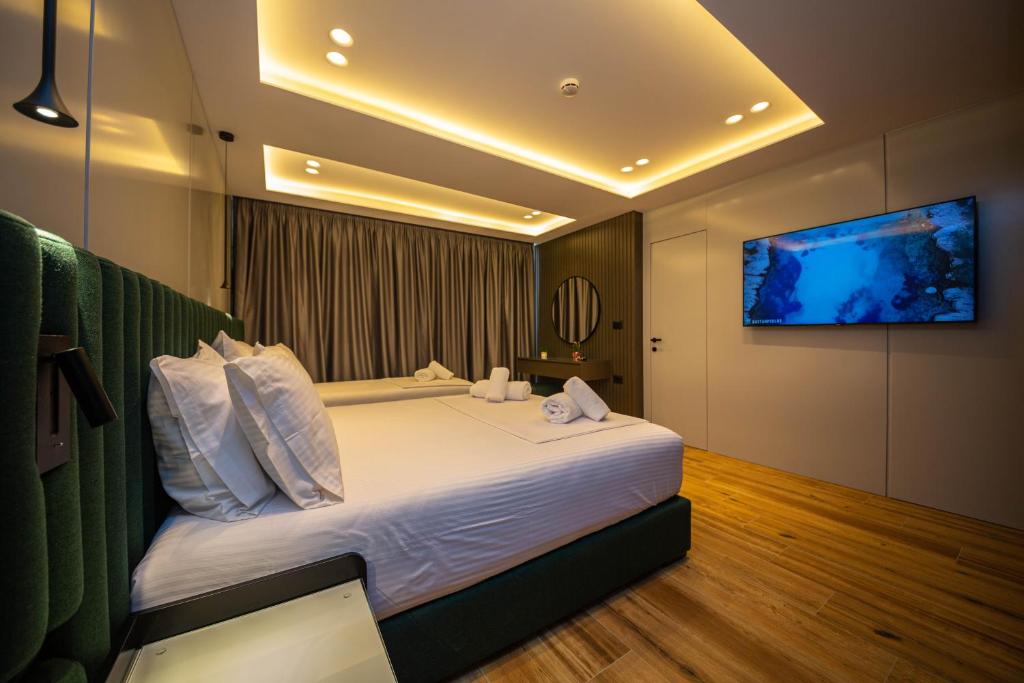 Postel nebo postele na pokoji v ubytování Hotel Lili-1