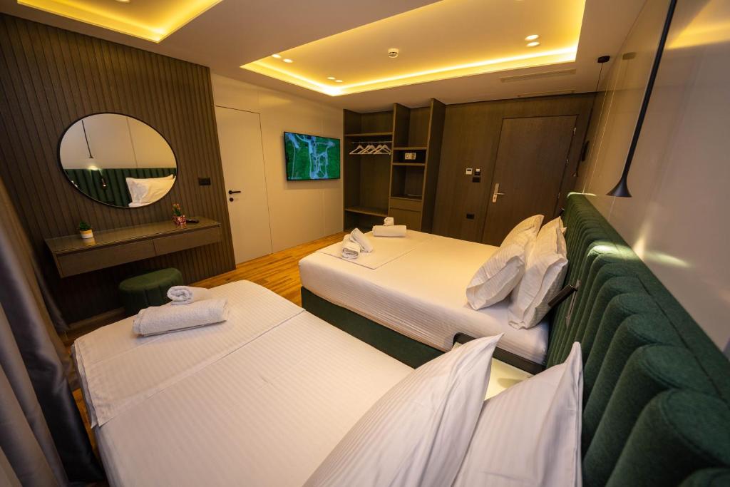 Postel nebo postele na pokoji v ubytování Hotel Lili-1